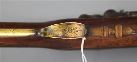 A late 18th century flintlock blunderbuss with sprung bayonet and brass barrel, 29in.